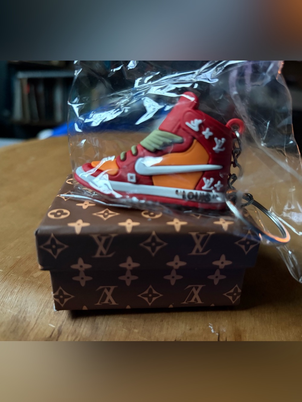 Nike Louis Vuitton Brown Monogram Box with Orange and Red Nike Shoe Keychain.